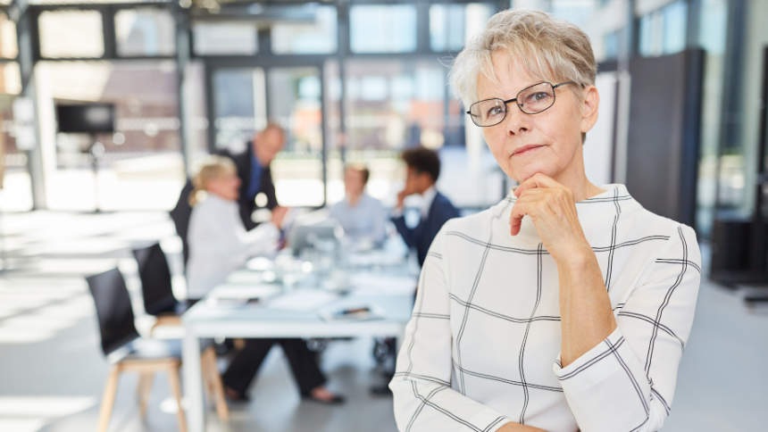 thoughtful-senior-woman-as-boss-in-the-meeting-in-the-office